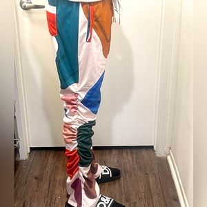 Men’s multi colored polyester pants with draw string waist!